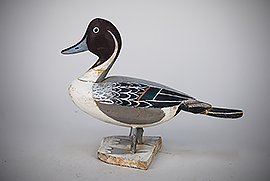 Large miniature standing pintail by a member of the Tyler family of Crisfield, MD. Wonderful piece of folk art. 
