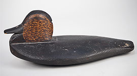 Lowhead black duck wingduck, similar to the decoys photographed on a sinkbox rig on the Platte River in Nebraska. Finely carved, inletted neck seat, excellent original paint, a rare find, ca. 1895.