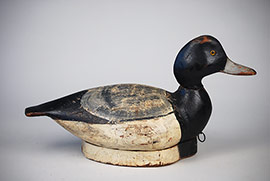 Rare pinch-breast bluebill by the Ward brothers of Crisfield, Maryland with an original attached bottom board in Miles Hancock paint used at a gunning club near Wallops Island