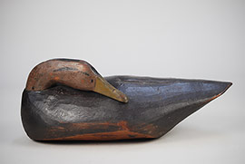 Sleeping black duck by an unknown Long Island maker. Wonderful folk appeal! 