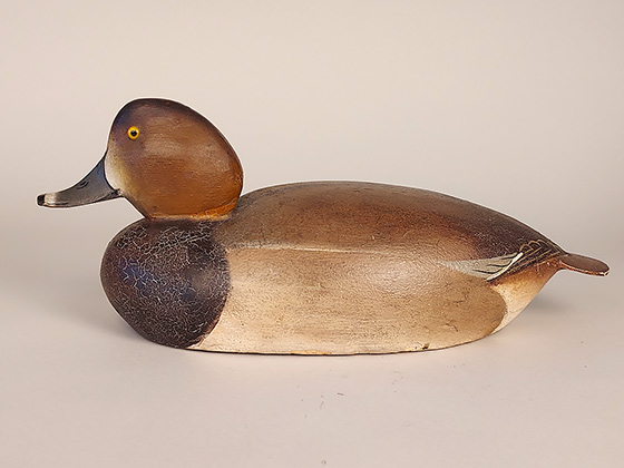 Balsa-bodied redhead hen by the Ward brothers of Crisfield, MD. Redheads are among the rarest gunning decoys by the Wards and this example is near mint.